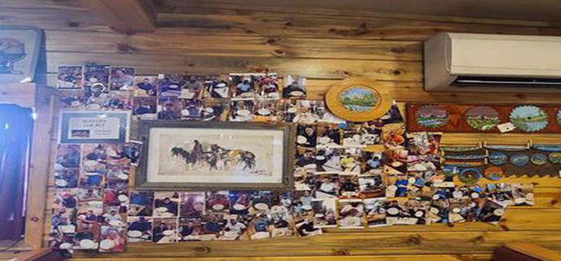 a picture of a wall of picture of people who completed the Challenge